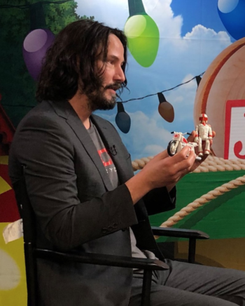 Photo of Keanu holding a Duke Caboom figurine