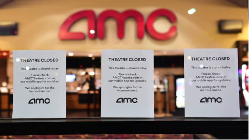 “Theatre Closed” signs outside an AMC location amid the COVD-19 pandemic