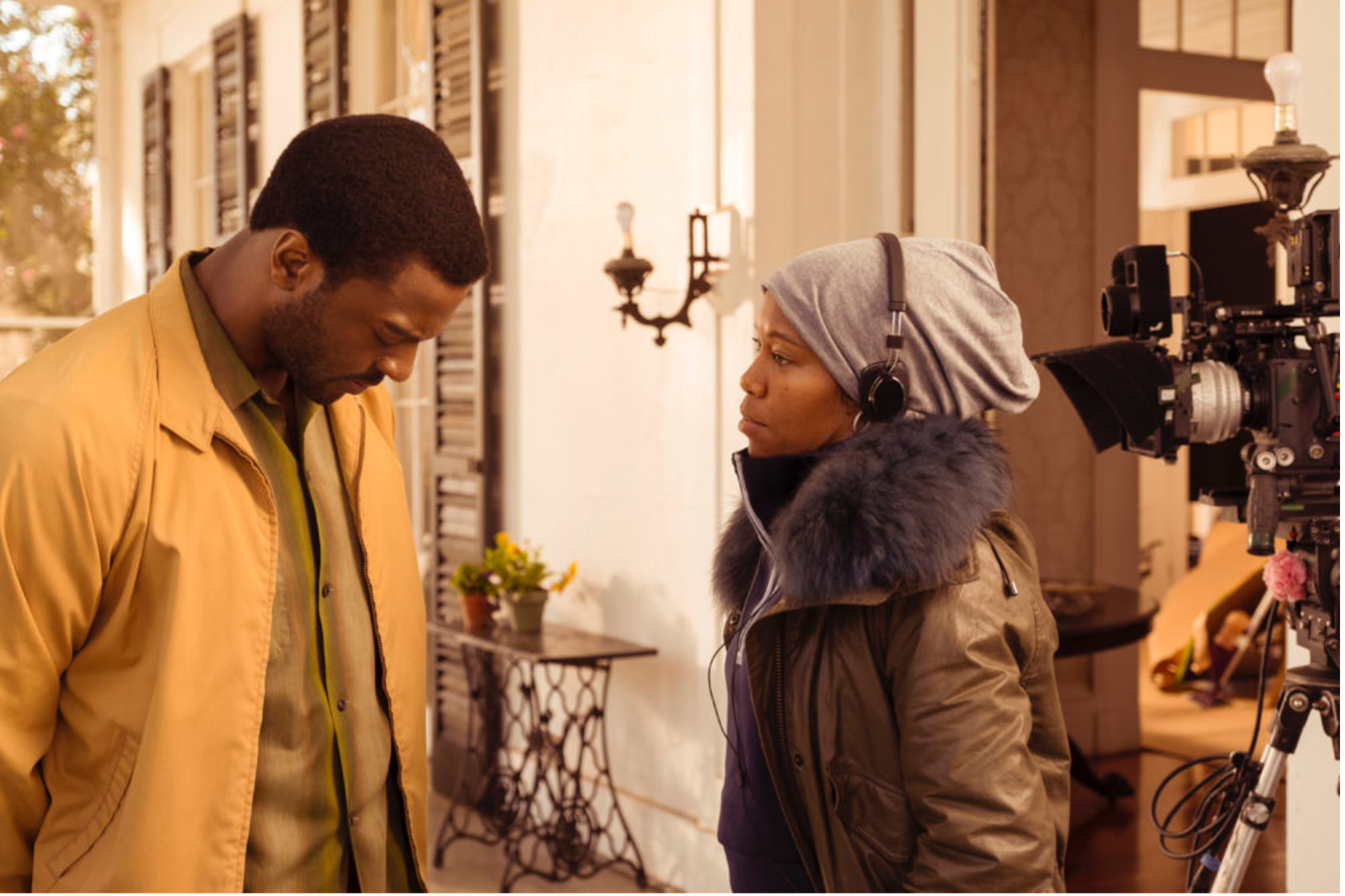 Aldis Hodge and Regina King on set