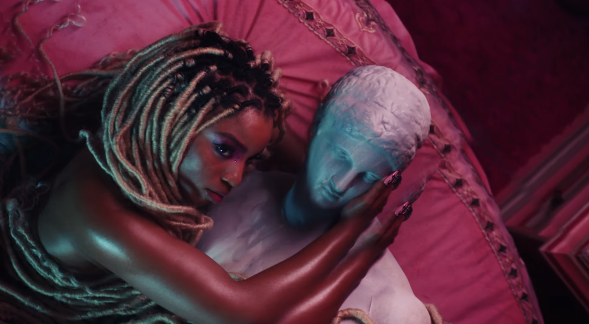 Picture of Chlöe alongside a statue in her music video “Have Mercy.”