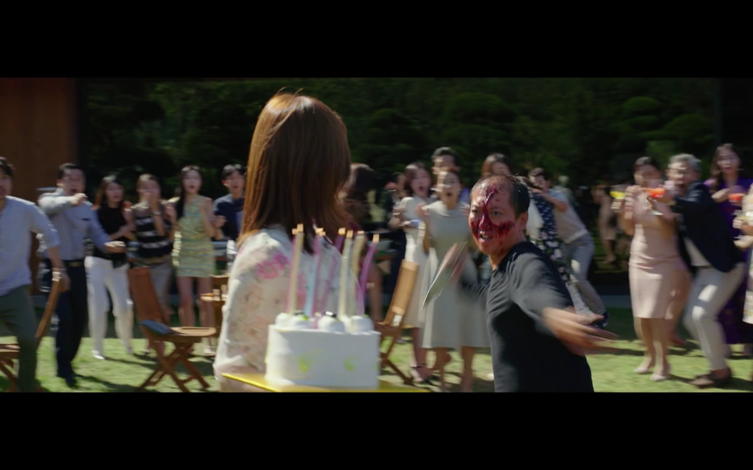 Man with knife lunges at woman holding birthday cake