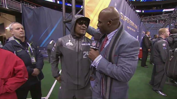 Marshawn Lynch and Deion Sanders during Super Bowl XLVIII's Media Day