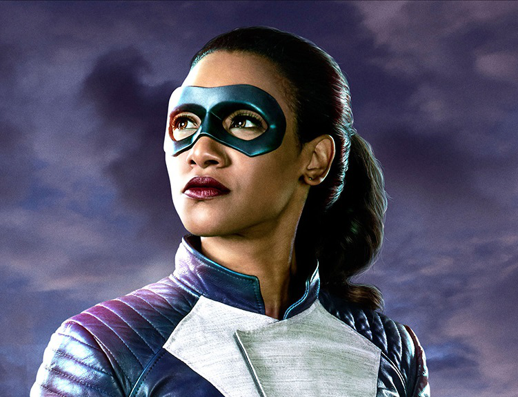 Iris West-Allen from CW's The Flash, played by Candice Patton, in her superhero costume, a purple leather jacket with a white streak and purple eye mask.
