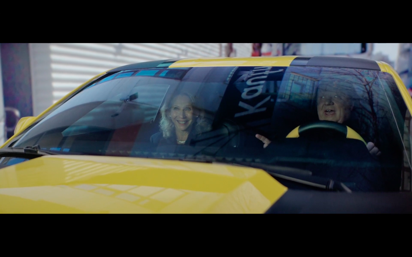 Paramount CEO Robert Bakish and Paramount Chairman Sheri Redstone smiling in a car in the action-packed introductory video for Paramount’s 2022 investor event, which featured the two executives speeding to the event in a shape-shifting Transformers vehicle.