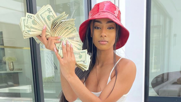 Rapper Rubi Rose holding a large sum of money