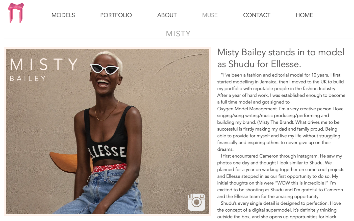 Online News Publication with the image of a Black woman in a tanktop, sunglasses, and bleached hair, laughing. Headline reads Misty Bailey stands in to model as Shudu for Ellesse.
