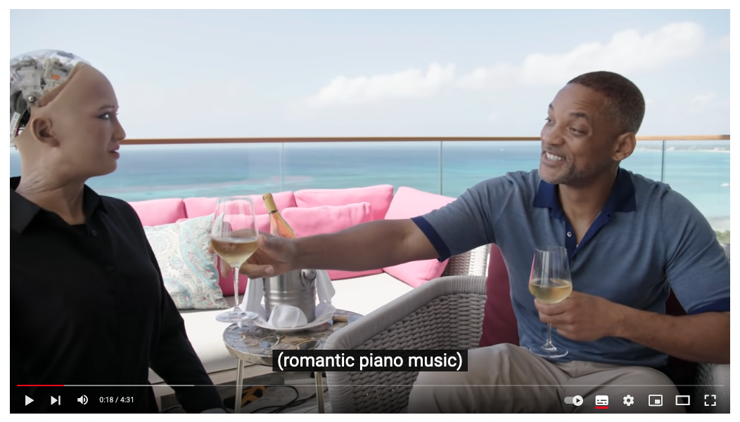 Actor Will Smith handing an android a glass of wine