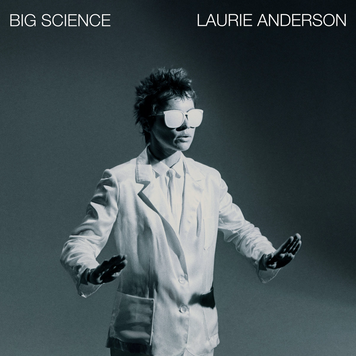 Album cover in black in white featuring photo of Laurie Anderson in white sunglasses, the name of the album Big Science and the musician's name in all white letters