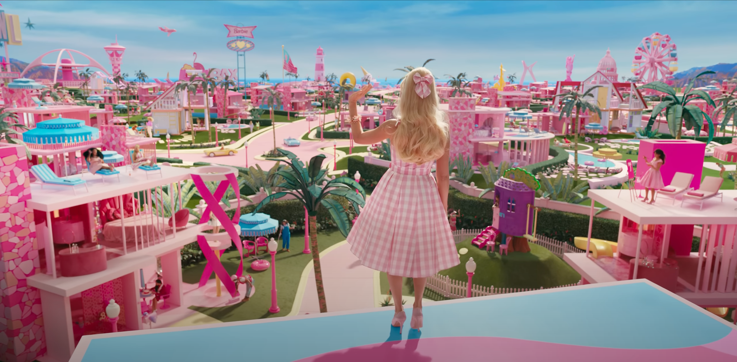 Barbie Standing in her Barbie House infront of Barbie Land