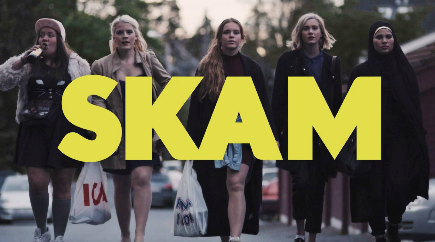 Five women walk forward in a line with the title SKAM center across the image.