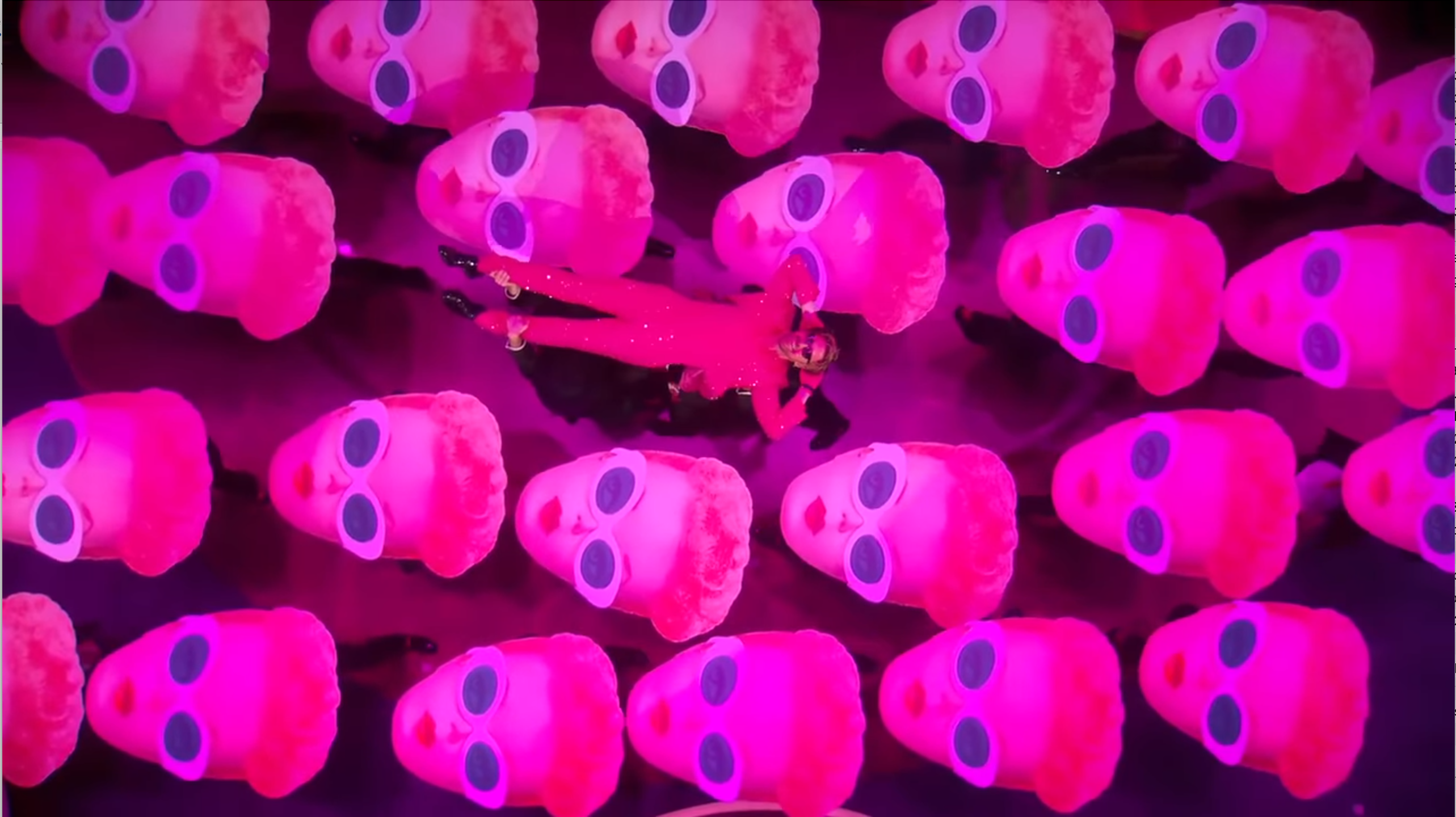Ken swimming in a sea of Barbies during the Academy Awards performance