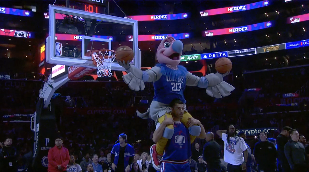The Los Angeles Clippers’ mascot Chuck performs with the team’s “Slam Squad” during a Clippers home game