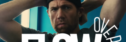 Over*flow title over image of Billy Eichner in backwards hat in Bros