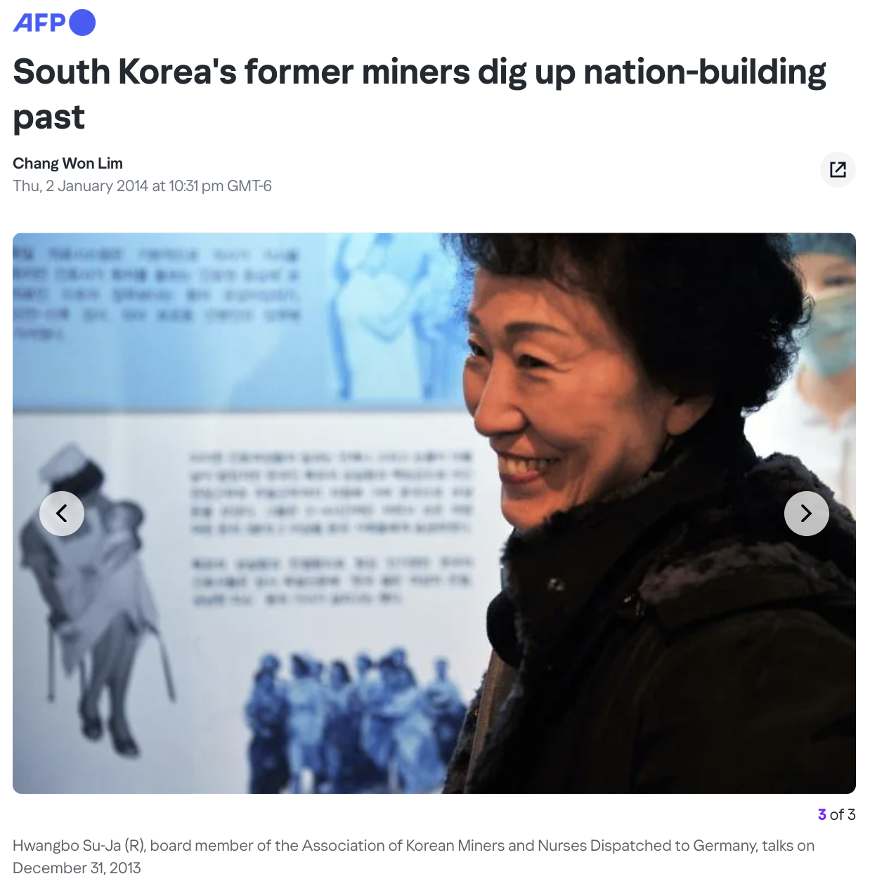 South Korean woman stands in front of mining display