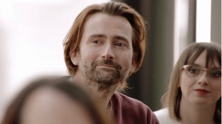 Close-up of David Tennant's face, emotional but smiling