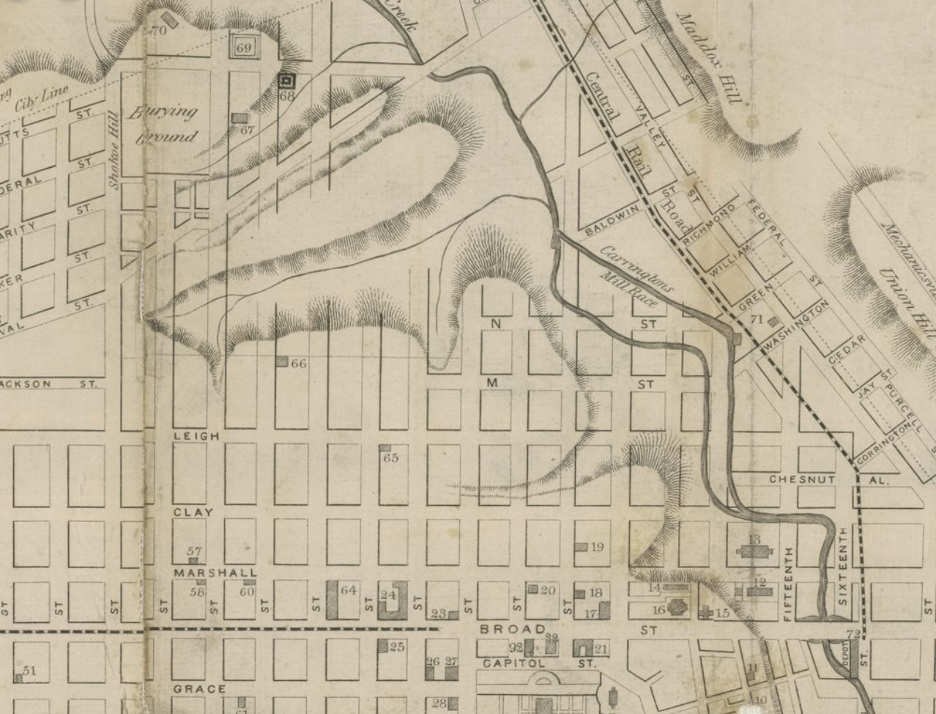 A close up of an old hand-drawn map of the city of Richmond, VA, squares are drawn to represent buildings