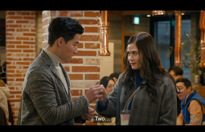 Two people standing in a restaurant